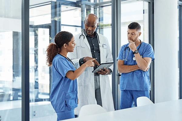 Healthcare professionals reviewing patient care together
